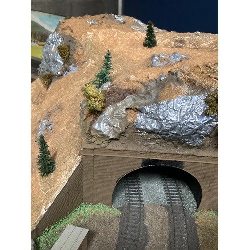 499 - A large custom built electric train track 187 x 125cm with scenery in 3 sections, a boxed Hornby OO ... 