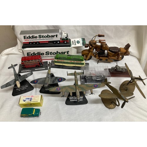 501 - A mixed lot of toys to include Atlas Edition Eddie Stobart lorry, wooden and metal motorcycle, dieca... 