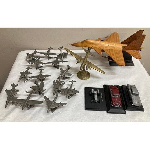 504 - A large collection of planes and cars to include mostly Royal Hampshire cast pewter, Hurricane, Hawk... 