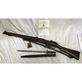 A Lee Enfield SMLE Number 1 MKIII 303 rifle deactivated, number W3802 with a 1907 leather sheathed b... 