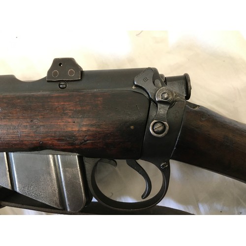 670 - A Lee Enfield SMLE Number 1 MKIII 303 rifle deactivated, number W3802 with a 1907 leather sheathed b... 