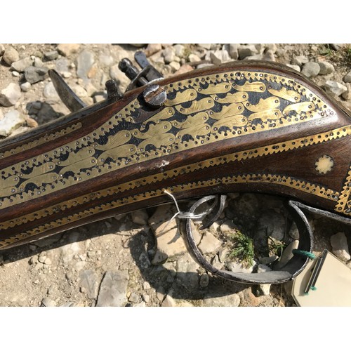 680 - Northwest Frontier Flintlock musket, 54'' tapered smooth bone barrel, stock heavily decorated with i... 