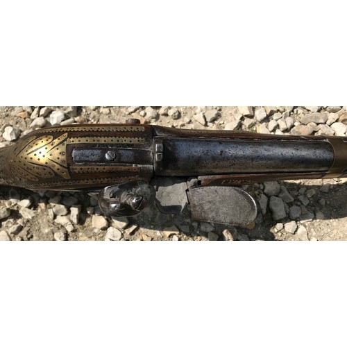 680 - Northwest Frontier Flintlock musket, 54'' tapered smooth bone barrel, stock heavily decorated with i... 