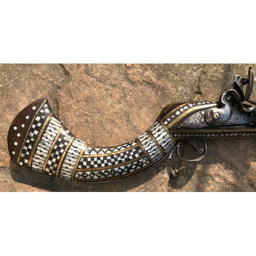 684 - Northwest Frontier Flintlock Musket with a 45'' tapered and ribbed barrel, stock heavily decorated w... 