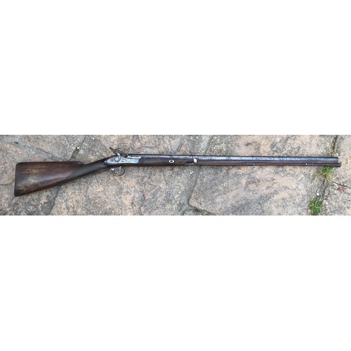 693 - A 19thC single bore rifle steel barrel, length 80cms, wooden ramrod under barrel, engraved steel sho... 