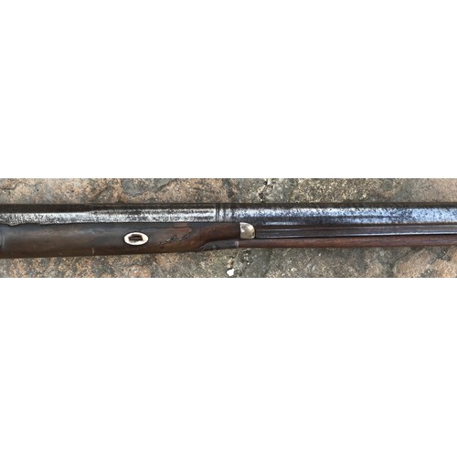 693 - A 19thC single bore rifle steel barrel, length 80cms, wooden ramrod under barrel, engraved steel sho... 