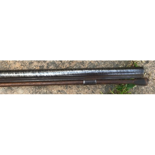 693 - A 19thC single bore rifle steel barrel, length 80cms, wooden ramrod under barrel, engraved steel sho... 