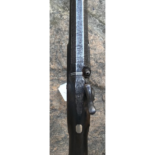 693 - A 19thC single bore rifle steel barrel, length 80cms, wooden ramrod under barrel, engraved steel sho... 