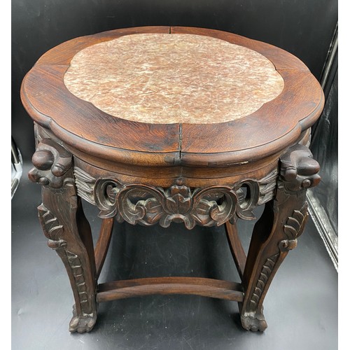 1217 - A Chinese hardwood stand with decorative marble inset top. 45cms h x 50cms w.