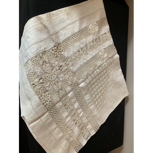 468 - A quantity of good quality hand embroidered table cloths to include Chinese silk crocheted etc.