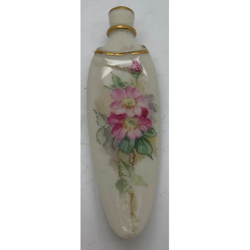 199 - A Royal Worcester late19th/early 20thc lay down scent bottle of tongue shaped design with floral and... 