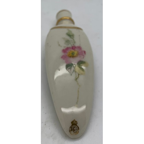 199 - A Royal Worcester late19th/early 20thc lay down scent bottle of tongue shaped design with floral and... 