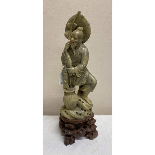 201 - Carved jadeite figure of a fisherman. 31cm.