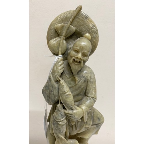 201 - Carved jadeite figure of a fisherman. 31cm.