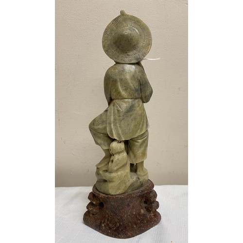 201 - Carved jadeite figure of a fisherman. 31cm.