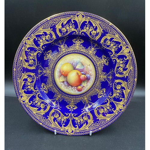 202 - A Royal Worcester fruit painted plate with blue and gilt border signed C.Hughes. 27cm d. In fitted b... 