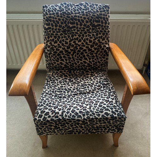 1230 - A mid century leopard design upholstered chair.