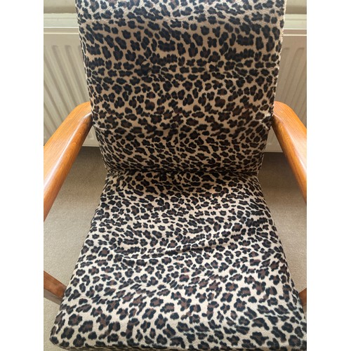 1230 - A mid century leopard design upholstered chair.