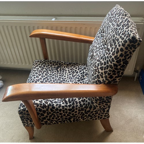 1230 - A mid century leopard design upholstered chair.