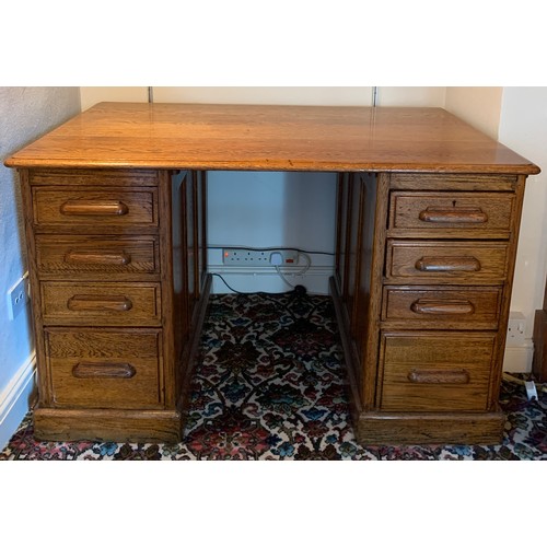 1244 - An early 20thC oak kneehole desk. 127 x 77 x 78cm h.