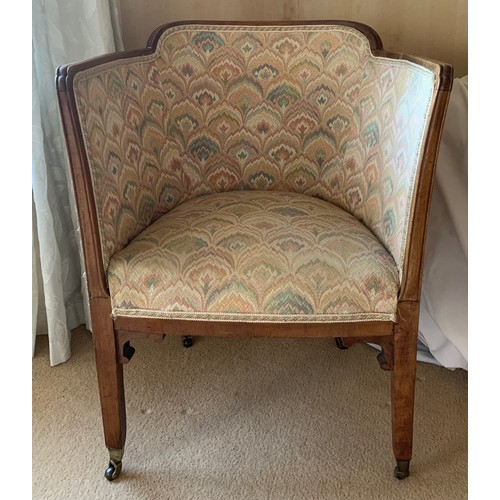 1246 - A mahogany framed armchair on brass castors.