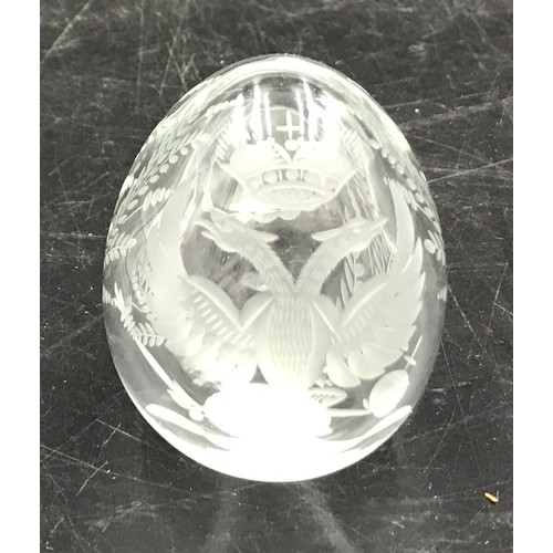 189 - A clear cut glass Faberge egg with sticker to bottom. 6 h x 5cm w.