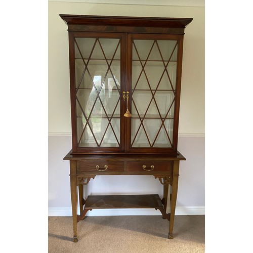 1252 - An Edwardian display cabinet with 2 glazed doors to top and 2 drawers to base on square tapered legs... 