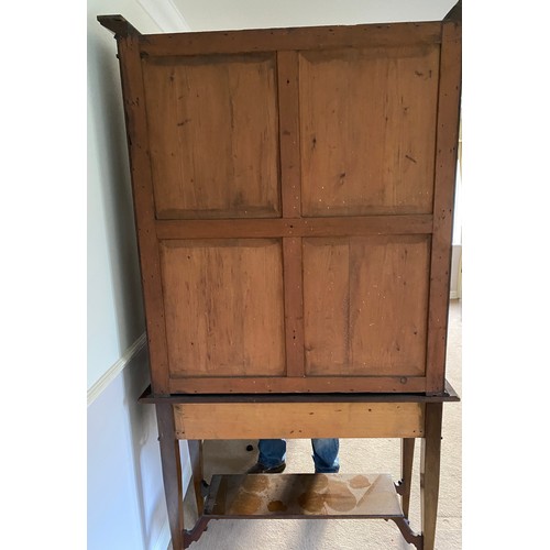 1252 - An Edwardian display cabinet with 2 glazed doors to top and 2 drawers to base on square tapered legs... 