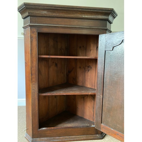 1255 - A 19thC single door oak corner cupboard with H hinges and 2 shelves to the interior. 80 w x 108 h x ... 