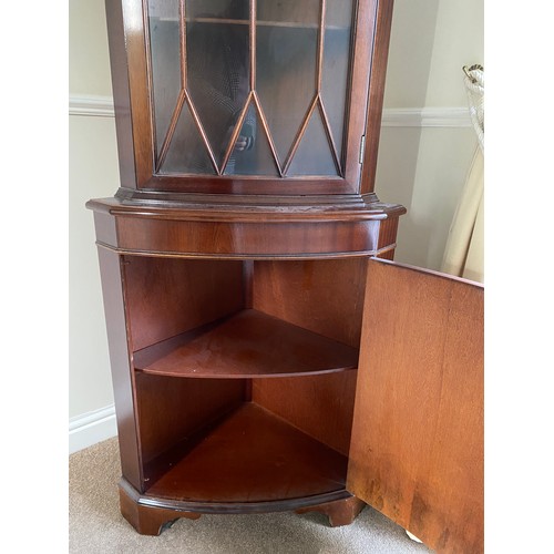 1260 - A reproduction mahogany tall corner display cabinet glazed to top.
65 w x 182 h x 48cm d.