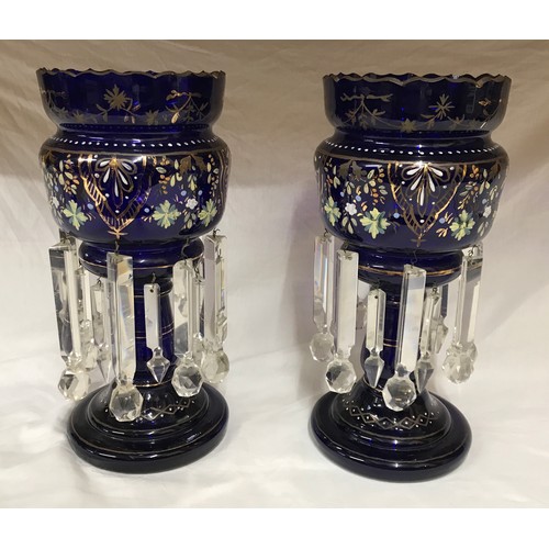 210 - A pair of blue glass lustres with gilt and hand painted floral decoration and heavy glass droplets. ... 