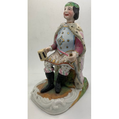 208 - A 19thC ceramic nodder figure depicting Old King Cole. 16cm h.