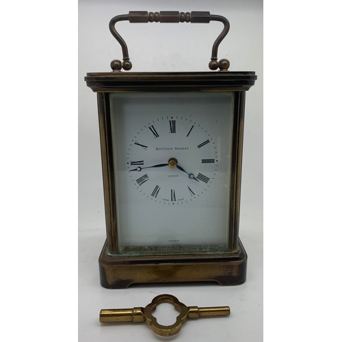 621 - A brass carriage clock by Matthew Norman . 18cm h.