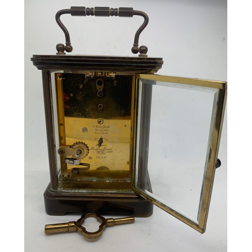 621 - A brass carriage clock by Matthew Norman . 18cm h.