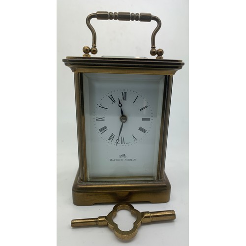 622 - A brass carriage clock by Matthew Norman. 14cm h. In working order.