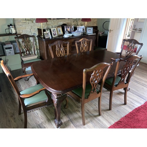 1262 - A mahogany wind out dining table on cabriole legs with ball and claw feet together with 8 chairs inc... 