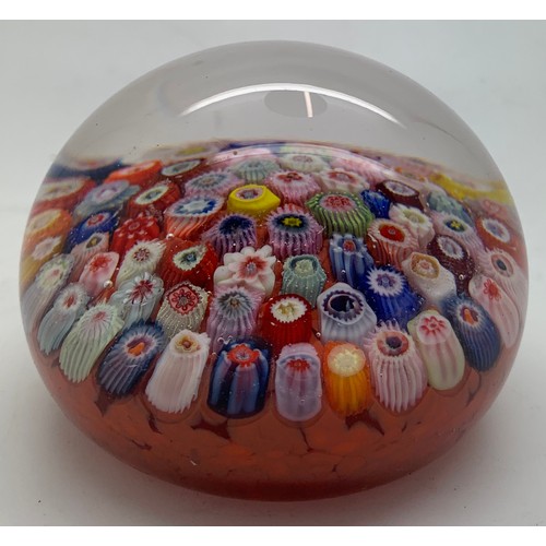 211 - A millefiori glass paperweight. Approx. 8cm d.