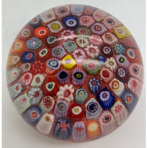 211 - A millefiori glass paperweight. Approx. 8cm d.