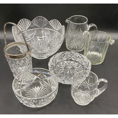 213 - A quantity of good quality cut glass to include 3 bowls, 2 jugs and 2 ice buckets.