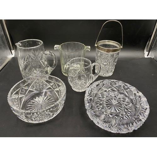 213 - A quantity of good quality cut glass to include 3 bowls, 2 jugs and 2 ice buckets.