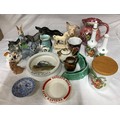 A selection of ceramics to includes Beswick donkey, Peter Rabbit and long haired dog, a Wade dog, Sy... 