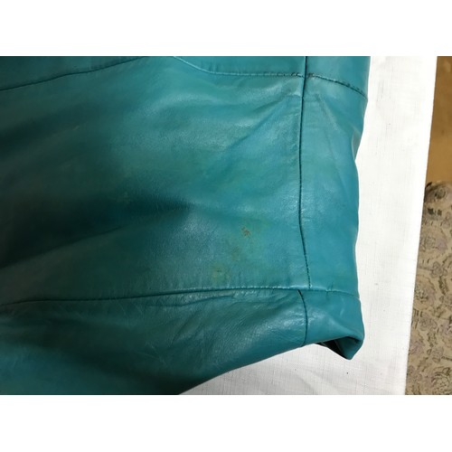 467 - A 1970’s turquoise leather ladies jacket made from Nappa leather, maker unknown. Size 64cm from armp... 