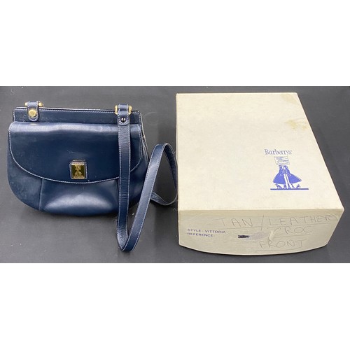 486 - A 1980's Burberry navy double sided handbag in original box. Marked 