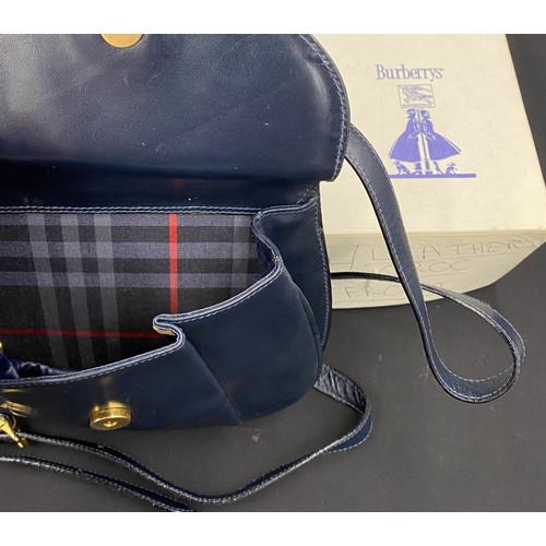 486 - A 1980's Burberry navy double sided handbag in original box. Marked 