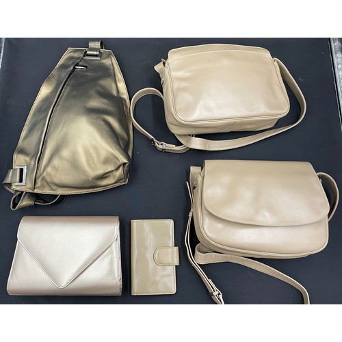 487 - Five soft leather handbag and purses in cream tones to include a harrie hendricks one strap rucksack... 