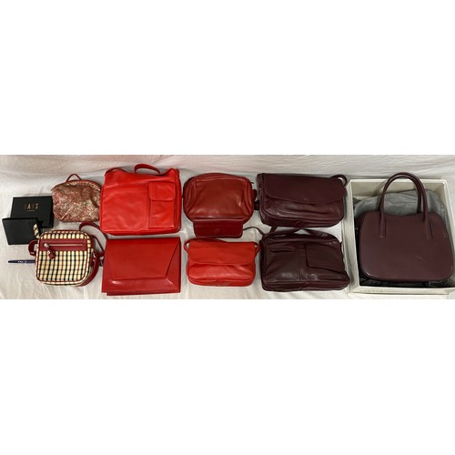 488 - Eleven leather hand bag and purses in red hues to include a maroon two handled handbag 28 w x 35.5cm... 