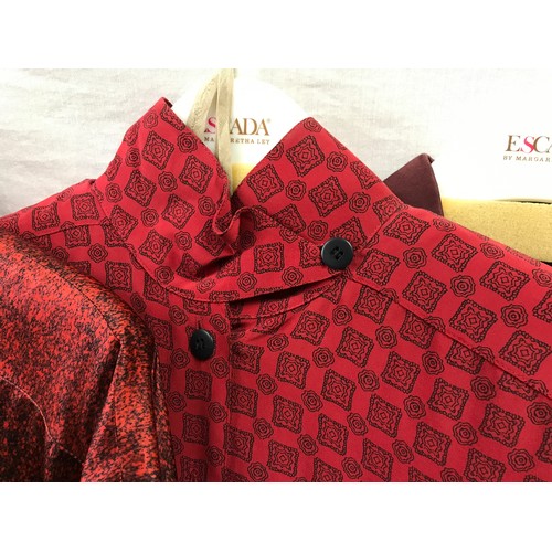 492 - Nine 1980's Escada silk shirts in red hues and various designs, clocks, floral etc. Sizes from left ... 