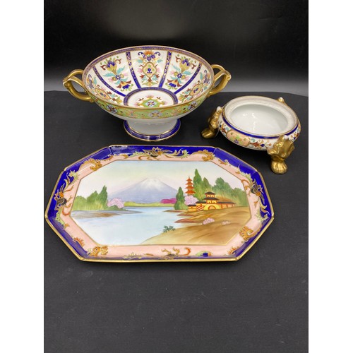 64 - A Noritake twin handled pedestal bowl with floral decoration. 11.5 x 31cm, tripod dish (no lid) 18cm... 