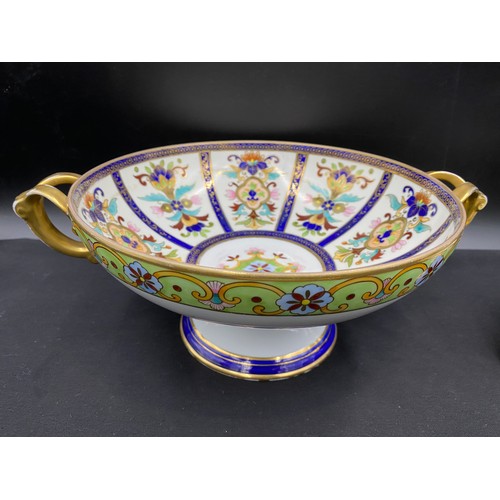 64 - A Noritake twin handled pedestal bowl with floral decoration. 11.5 x 31cm, tripod dish (no lid) 18cm... 