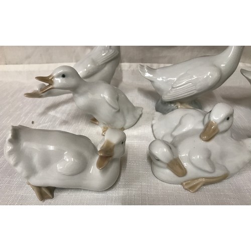 78 - A collection of 7 Nao Lladro geese. Largest 13cm h.